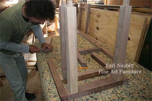 Earl in shop assembling custom made chair frames